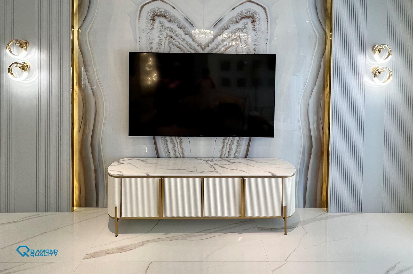 TV wall with marble veins, gold trims, and modern lighting in classic villa renovation Dubai.