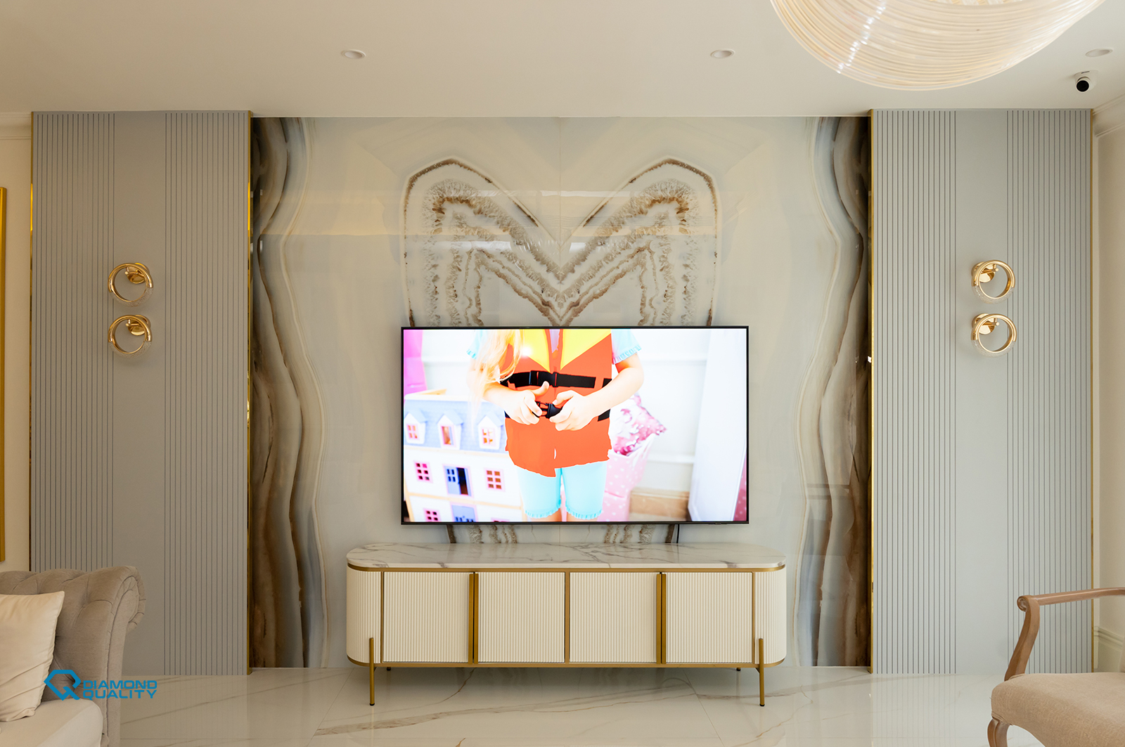 Classic staircase with marble steps, gold railing, and elegant detailing in Dubai luxury villa renovation.